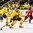 GRAND FORKS, NORTH DAKOTA - APRIL 18: Sweden's Jakob Cederholm #3 attempts to let a shot go while Linus Lindstrom #28 and Switzerland's Janik Loosli #16 look on during preliminary round action at the 2016 IIHF Ice Hockey U18 World Championship. (Photo by Minas Panagiotakis/HHOF-IIHF Images)

